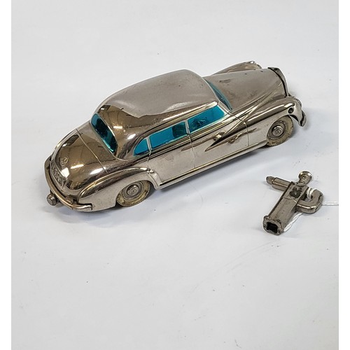 130 - A Prameta clockwork chrome finish Mercedes-Benz 300 with origianl 'P' key 14cm.