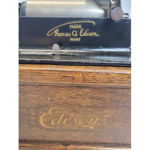 139 - A Thomas Edison phonograph serial number 113605 with two boxes of 87 discs and a speaker.