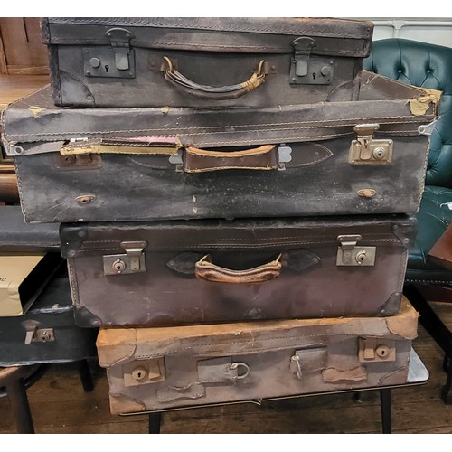 142 - Four vintage suitcases