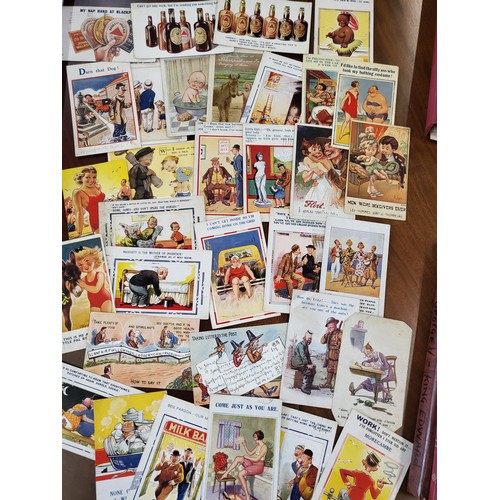 149 - Four packets of numerous postcards of seaside scenes and humorous cartoons.