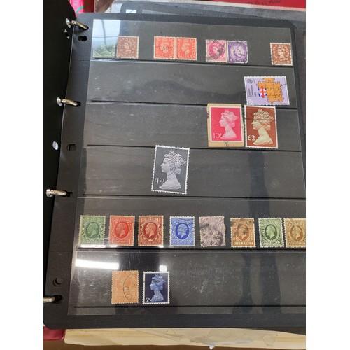 153 - British stamps in several albums and a folder with loose stamps