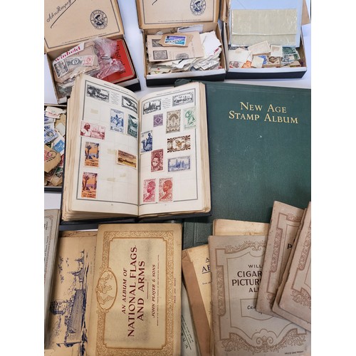 154 - A quantity of stamps, loose and in complete albums including New Age stamp album British Empire and ... 