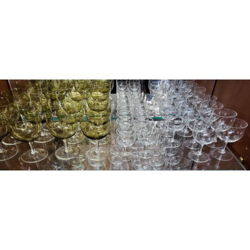 156 - Twelve wine glasses with tinted cup-shaped bowls and sets and part sets of wine glasses and Brandy g... 