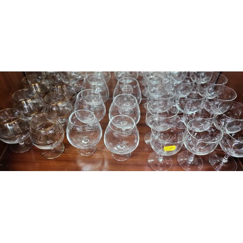 156 - Twelve wine glasses with tinted cup-shaped bowls and sets and part sets of wine glasses and Brandy g... 