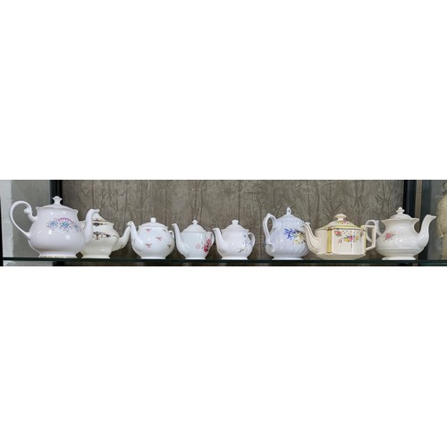 193 - Eight tea pots including Sadler, Meakin, and Rayware. (8)