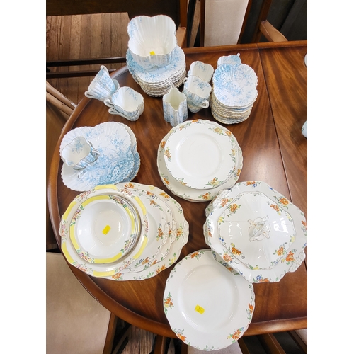 204 - Two Meakin part dinner services and a blue and white tea set (lacks teapot) (64)