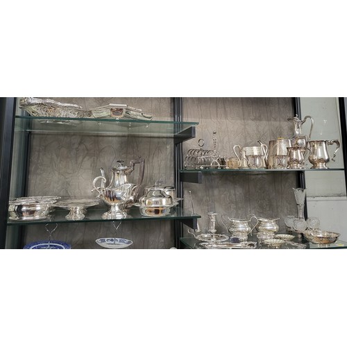 212 - A group of silver plate items including candle holder and snuffer, cream jug, tankards, wine bottle ... 