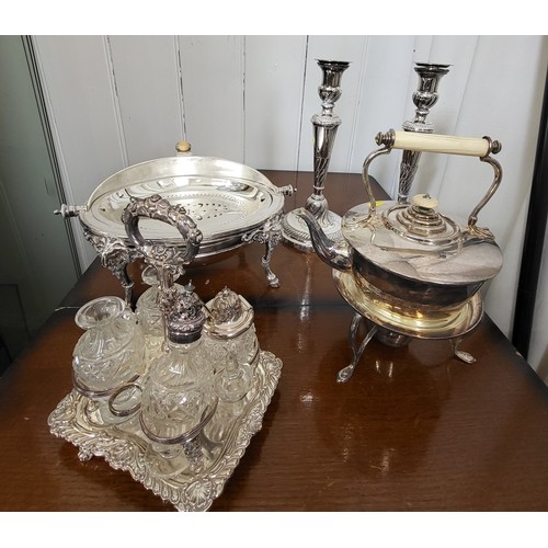 213 - A quantity of silver plate and silver including large trays, knives and forks, candlesticks, etc.