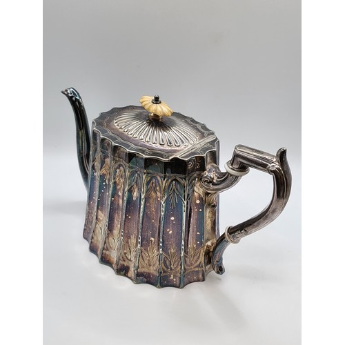 214 - A scalloped silver plate teapot. 15cms. 786g.