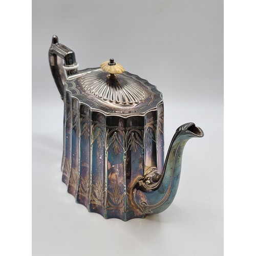 214 - A scalloped silver plate teapot. 15cms. 786g.