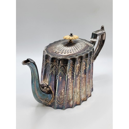 214 - A scalloped silver plate teapot. 15cms. 786g.