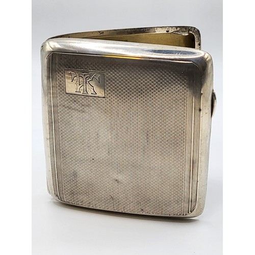 225 - A 1940 silver cigarette case, Birmingham. Robert Pringle & Sons. Machine turned and monogrammed 'TK'... 