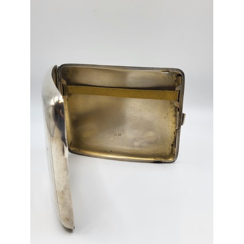 226 - A curved cigarette case, 1918. Machine turned, heavy weight. Birmingham (A & J Zimmerman) 11cm x 9cm... 