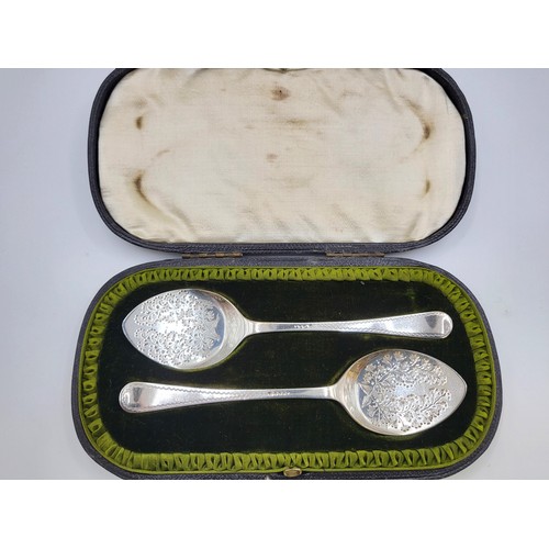 227 - A pair of silver spoons, cased. highly decorated foliage bowl Sheffield 1899. 41g.