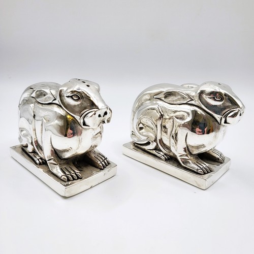 229 - A pair of rabbit condiments in the Art Deco style stamped 800 to the base. 374g. 5.5cm x 5.5cm x 4cm