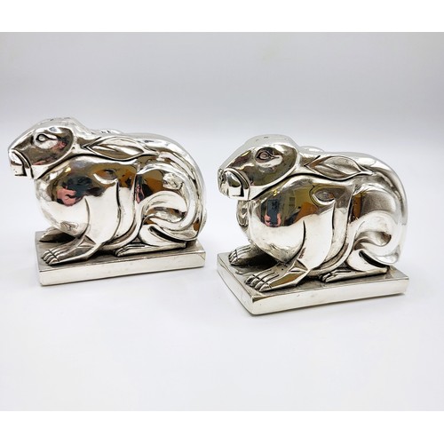 229 - A pair of rabbit condiments in the Art Deco style stamped 800 to the base. 374g. 5.5cm x 5.5cm x 4cm