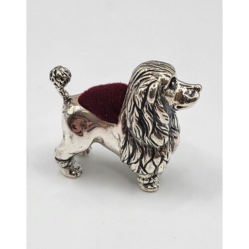 232 - A silver poodle dog pin cushion. 2.5cm x 3cm. 13g.