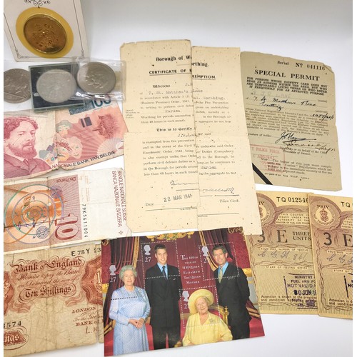 237 - Coins and bank notes including English ten shillings, Swiss and Belgian, ration coupons from the Min... 