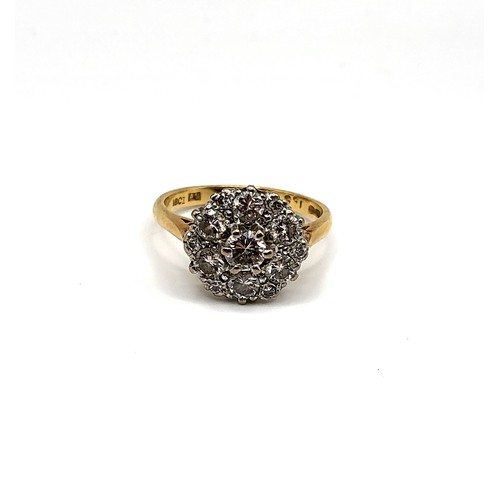 241 - An 18ct yellow gold and diamond daisy cluster ring, centred with a round brilliant-cut diamond of ap... 