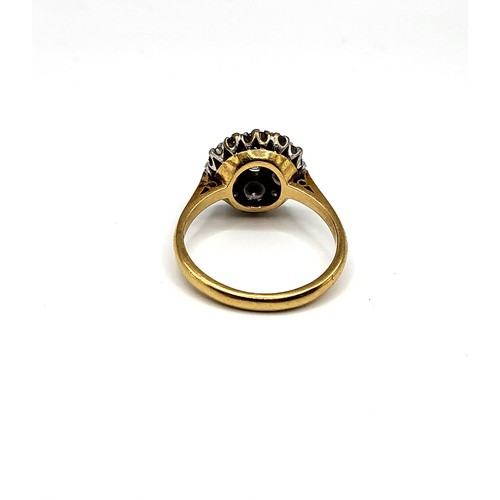 241 - An 18ct yellow gold and diamond daisy cluster ring, centred with a round brilliant-cut diamond of ap... 