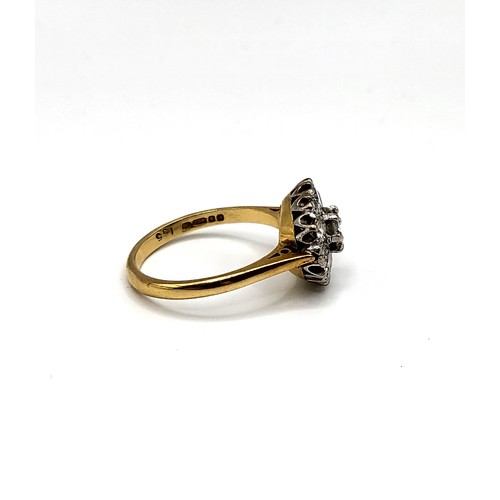 241 - An 18ct yellow gold and diamond daisy cluster ring, centred with a round brilliant-cut diamond of ap... 