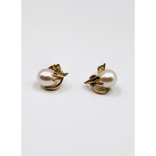 246 - Cultured pearl earrings set in 9ct yellow gold.