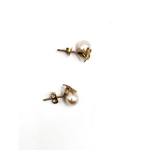 246 - Cultured pearl earrings set in 9ct yellow gold.