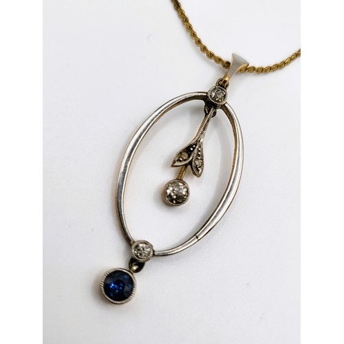 265 - An Edwardian necklace with three diamonds and a sapphire