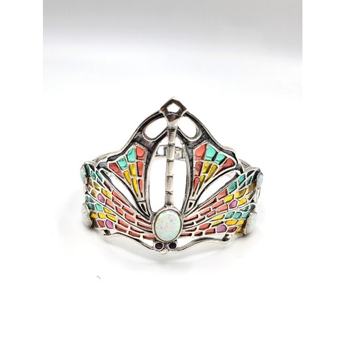 266 - A silver and plique a jour Art Deco style cuff bangle with opal-style cabochons. 24g. 4cm x 6cm diam... 