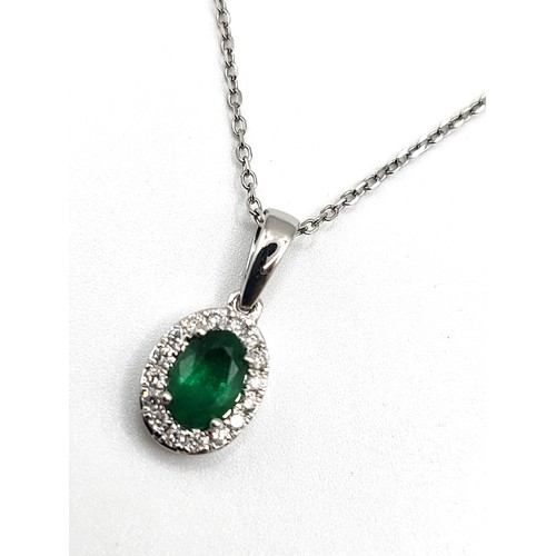 269 - An 18ct white gold emerald and diamond pendant (approx 1cm x 0.5cm) on an 18ct white gold  necklace ... 