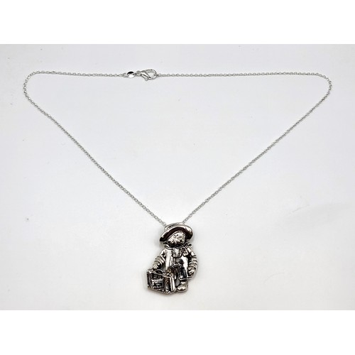 274 - A silver Paddington Bear pendant necklace. Pendant 3.5cm x 3cm, necklace 45cm. 10g