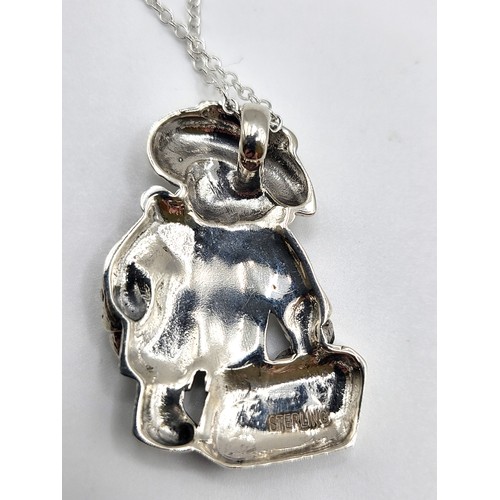 274 - A silver Paddington Bear pendant necklace. Pendant 3.5cm x 3cm, necklace 45cm. 10g