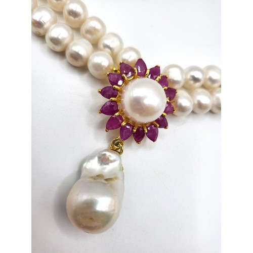 275 - An impressive fresh water pearl double row necklace with ruby clasp 46cm