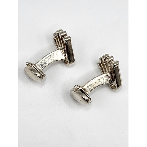 277 - A pair of silver Rolex-style cufflinks. Approx 1.5cm x 1.5cm. 11g