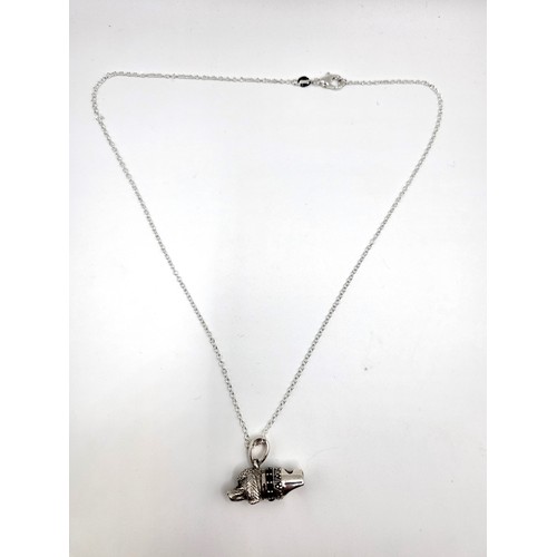 282 - A silver dog whistle (3cm x 1cm) with collar in the form of a pendant necklace (44cm) 10g