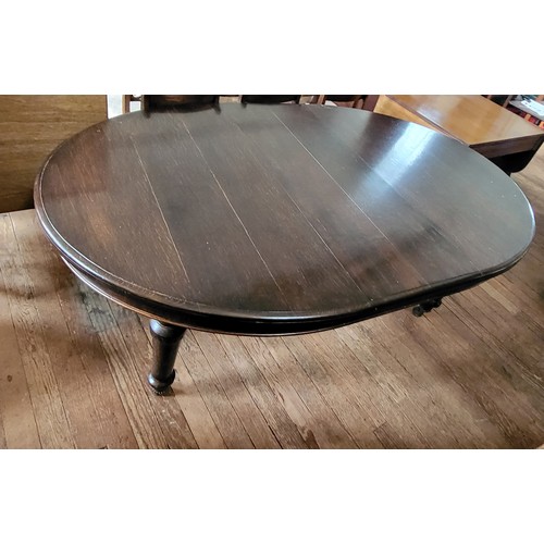 58 - A Victorian table on casters with one matching extra leaf  and a spare non matching leaf (61cm x 121... 