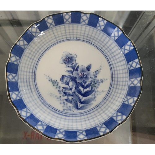 203 - A Chinese celkadon ground famille rose with birds and butterflies 22cm, four graduated blue and whit... 