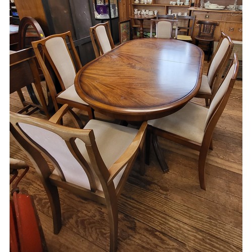 32 - A Meredew extending dining table and six chairs (including two carvers). 74cm x 148cm x 95cm, unexte... 