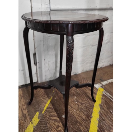 33 - A mahogany Regency-style  occasional table. Damage to surface.