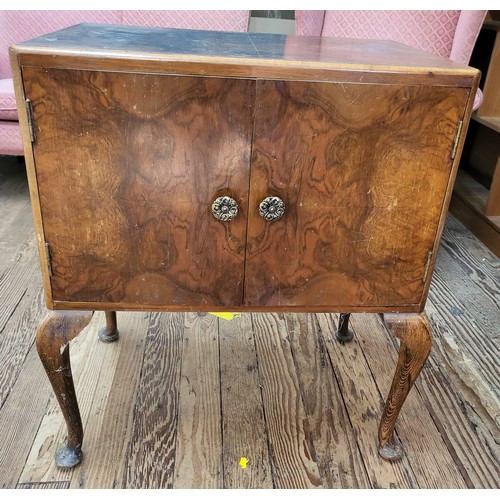 25 - A burr walnut veneer LP cabinet on cabriole legs 71cm x 60cm x 38cm.