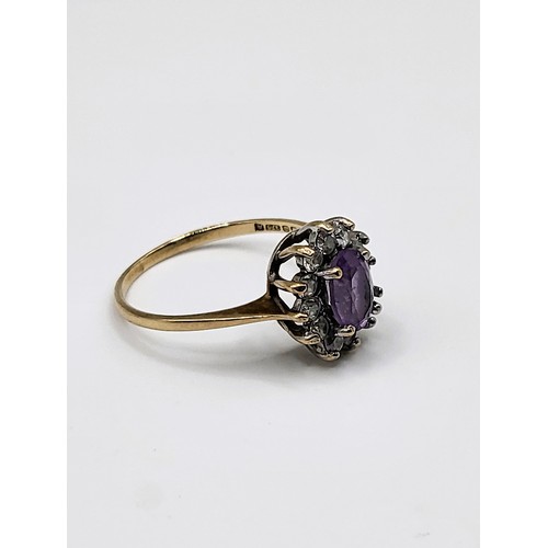 234 - 9ct yellow gold ring (hallmarked) with oval gemstone (tests as morganite) and paste surround. Size M