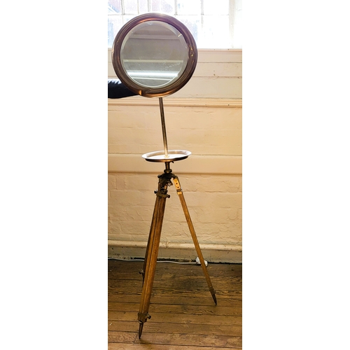 5 - A campaign mirror on tripod stand. mirror measures 44cm diameter.