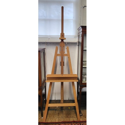 7 - A Mabef Italian wooden artist's easel with adjustable mechanisms.