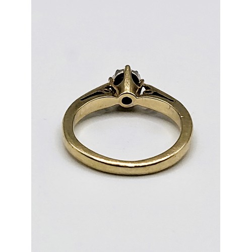 236 - A 9ct yellow gold diamond solitaire, claw set, approximately 20 point stone. 2.3gms. Size G