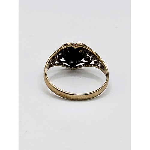 237 - A 9ct yellow gold ring set with heart shaped black onyx in illusion type setting (loose kin setting)... 