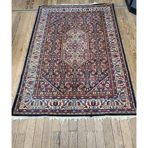 50 - A blue and red rug 205cm x 139cm