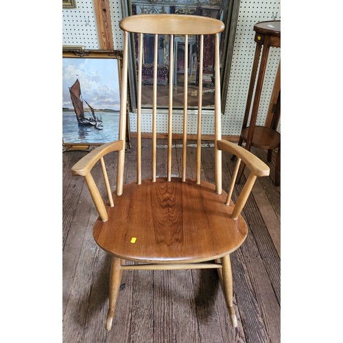 9 - A high back rocking chair (Stoe-Yugoslavia) 102cm.