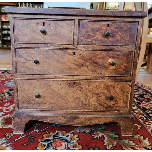 27 - A miniature chest of two short over two long drawers 42cm x 43cm x 25cm.