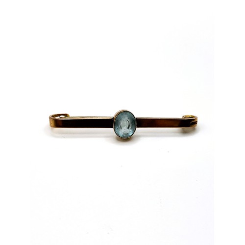 238 - Four pins including 9ct gold pin 5.2mm pearl, rose gold (unmarked) tie pin with oval cut blue paste,... 