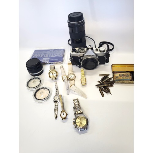 292 - A collection of seven watches and an Olympus Omio SLR camera with a Tamron 110mm telephoto lens and ... 